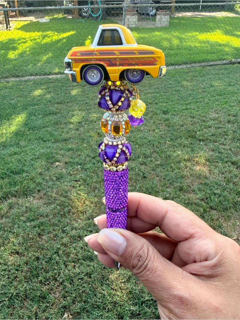 Lowrider 64 Impala Car Tuned Topper Pen with Purple and Yellow Accents.
